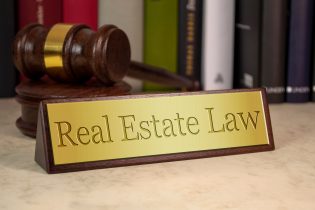 Golden,Sign,With,Gavel,And,Real,Estate,Law