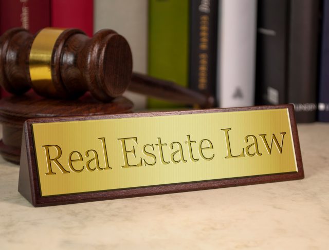 Golden,Sign,With,Gavel,And,Real,Estate,Law